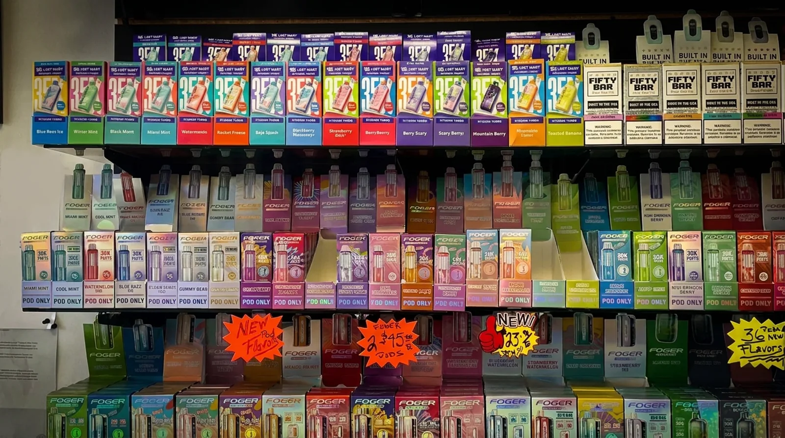 The disposable vape wall — Lost Mary, Fifty Bar and Foger — at a Corpus Christi smoke shop